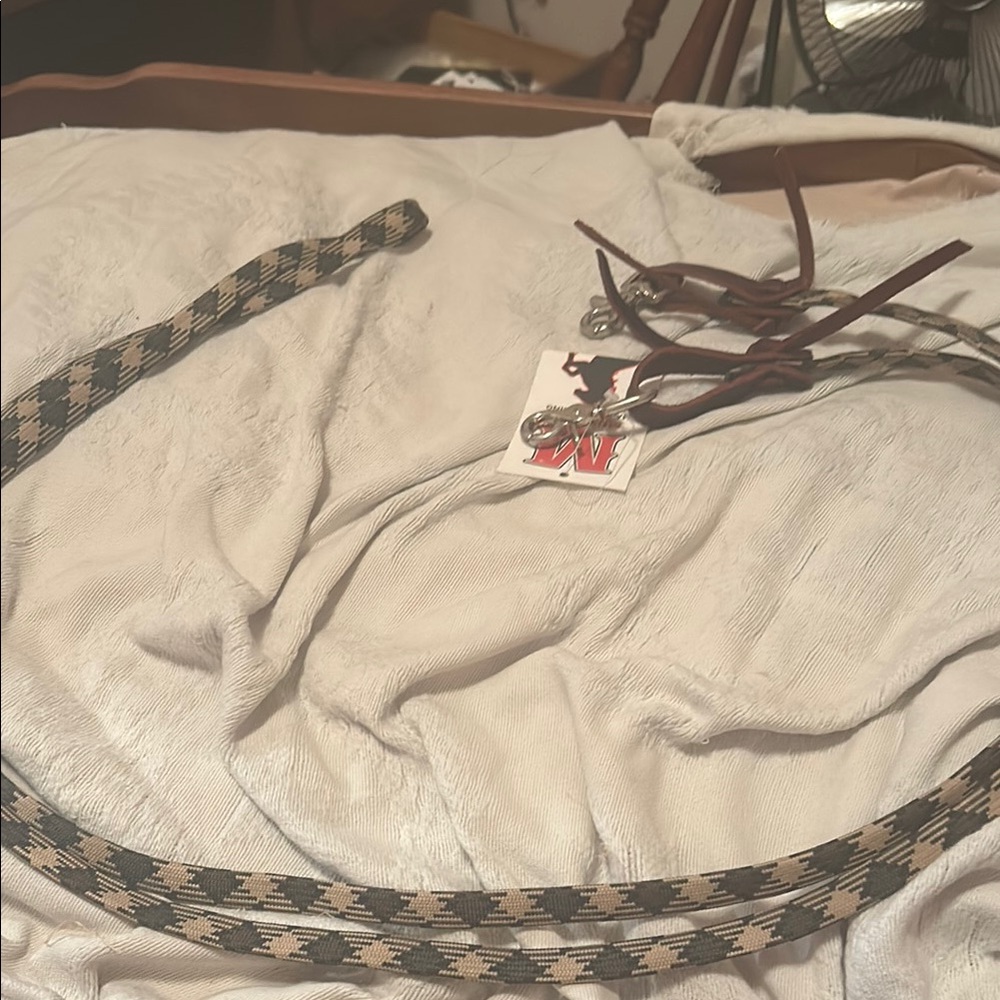 Black,brown, and tan horse reins